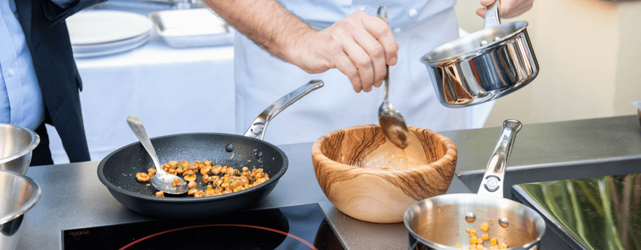 A kitchen worktop with pots and pans.